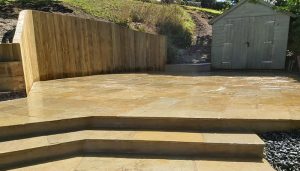 Here we have completely transformed a garden in Guernsey by adding steps and a patio area on a hill.